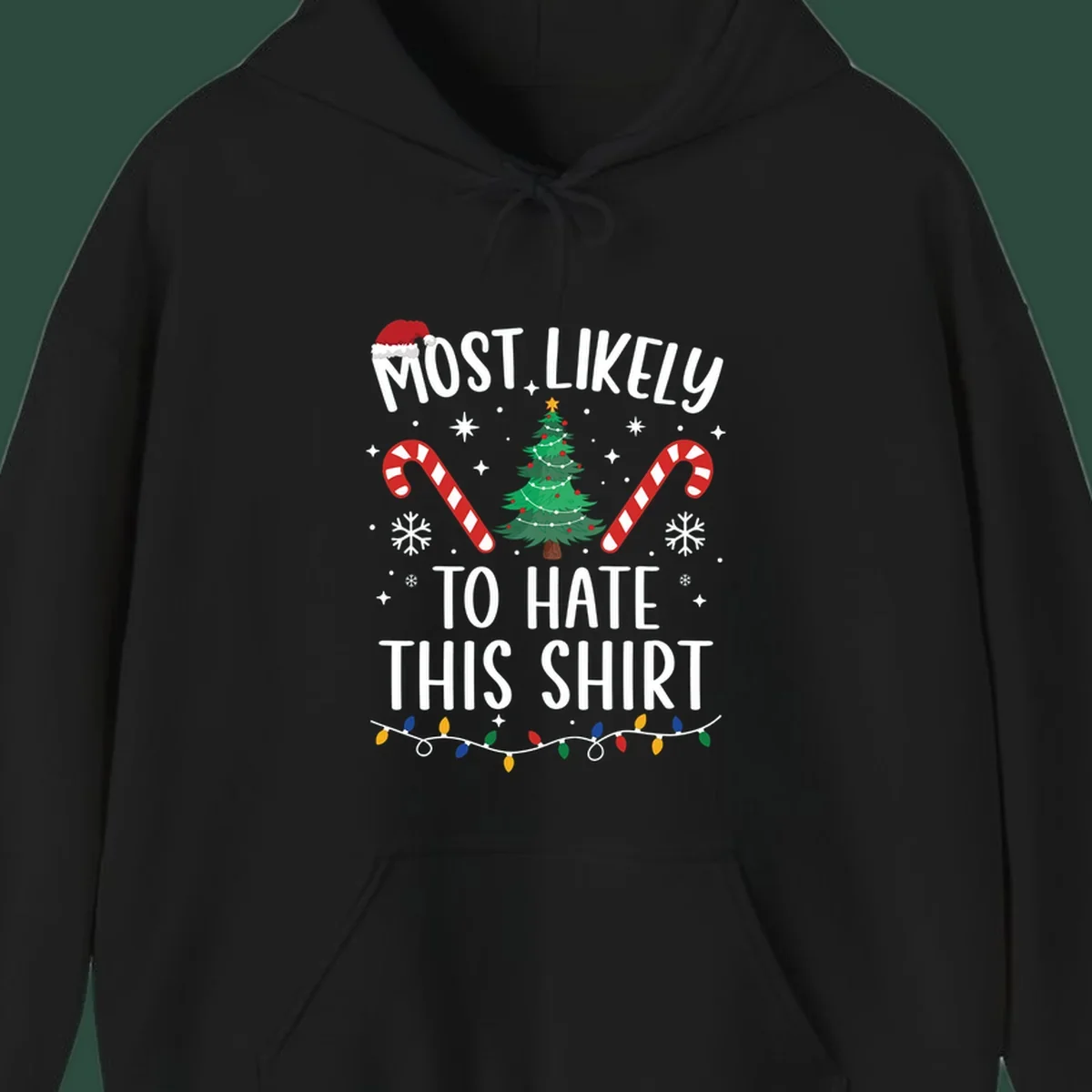Text 'Most Likely To Hate This Shirt' with Christmas graphics like a tree, candy canes, and Santa hat.