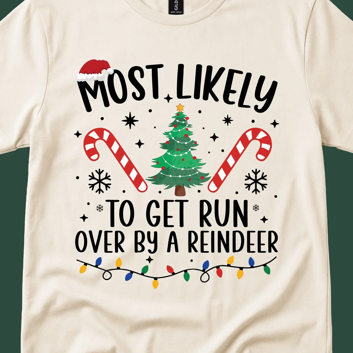 Most likely to get run over by reindeer Christmas design with tree, candy canes, and lights.