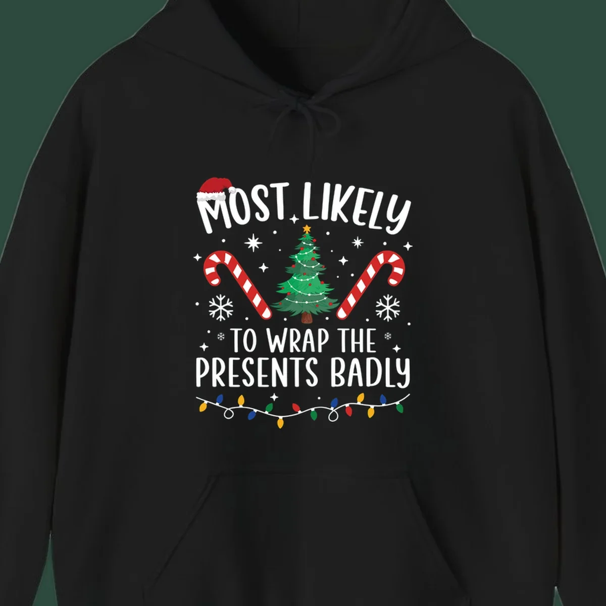 Most Likely To Wrap Presents Badly Christmas design with text, tree, candy canes, and lights.