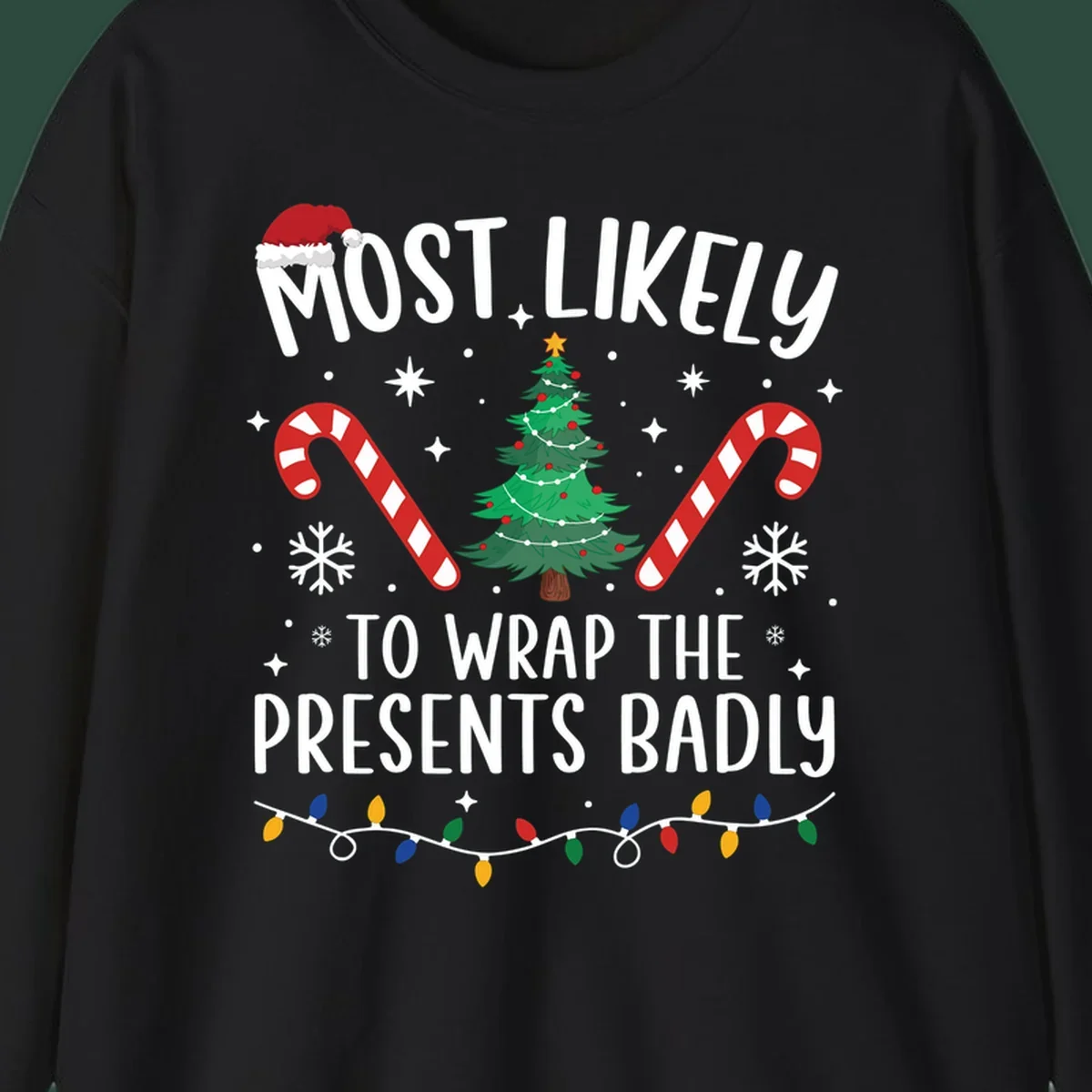 Most Likely To Wrap Presents Badly Christmas design with text, tree, candy canes, and lights.