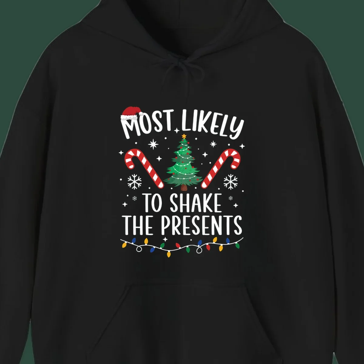 Christmas design with text "Most Likely To Shake The Presents", Santa hat, candy canes, tree, snowflakes, and lights.