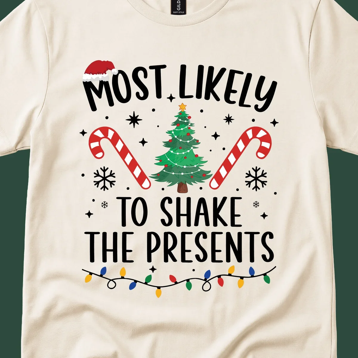 Christmas design with text "Most Likely To Shake The Presents", Santa hat, candy canes, tree, snowflakes, and lights.