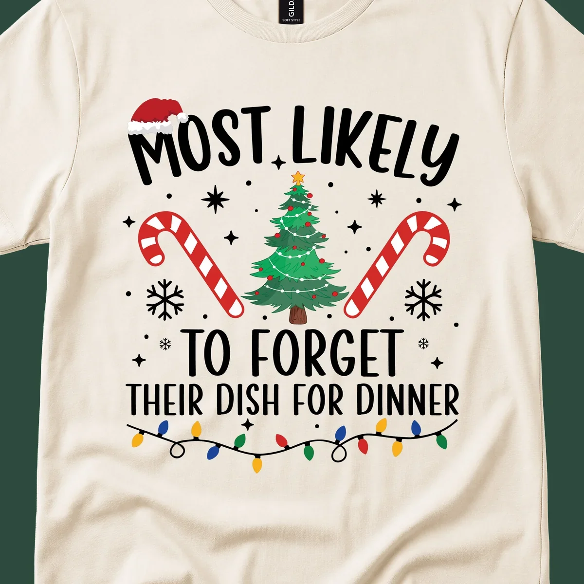 Most Likely To Forget Their Dish Christmas design with text, tree, candy canes, and lights.