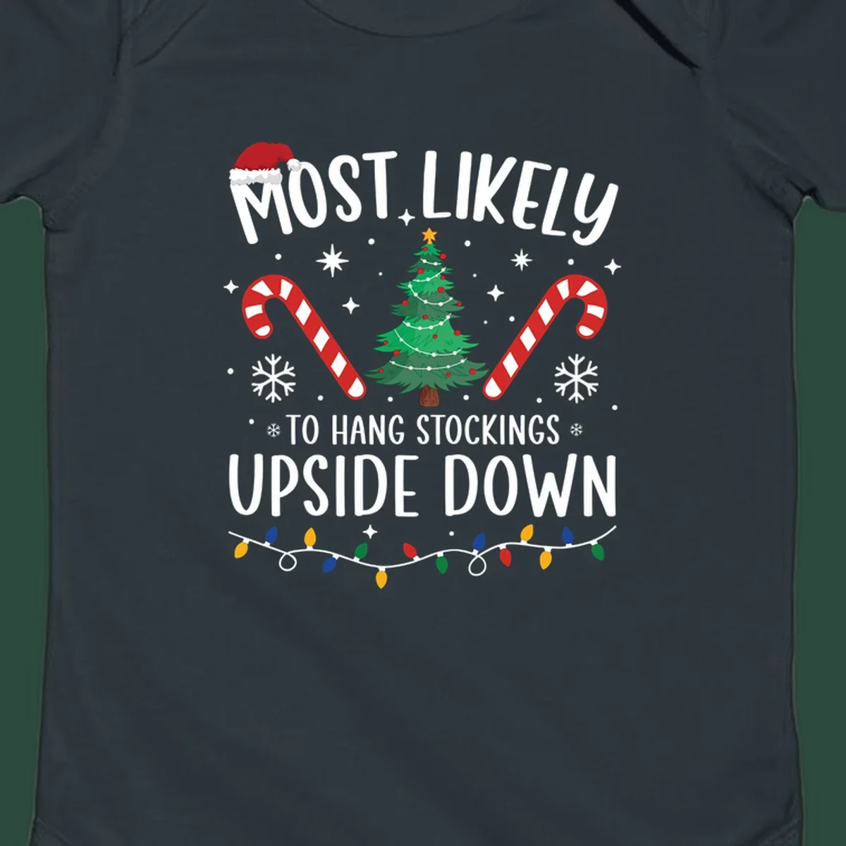 Most Likely To Hang Stockings Upside Down Christmas graphic with tree, candy canes, and Santa hat.