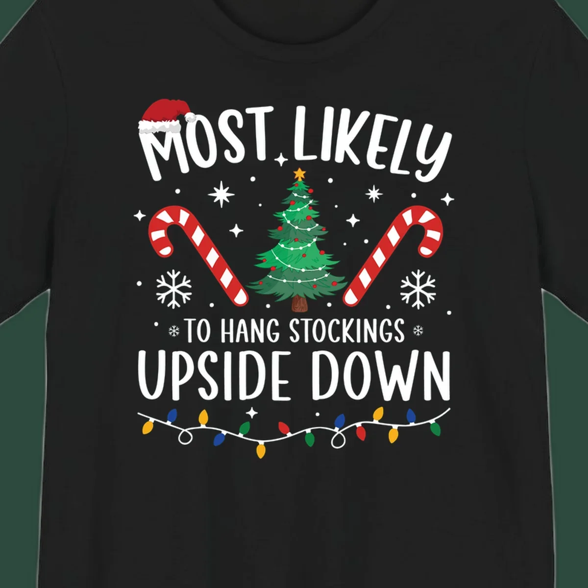 Most Likely To Hang Stockings Upside Down Christmas graphic with tree, candy canes, and Santa hat.