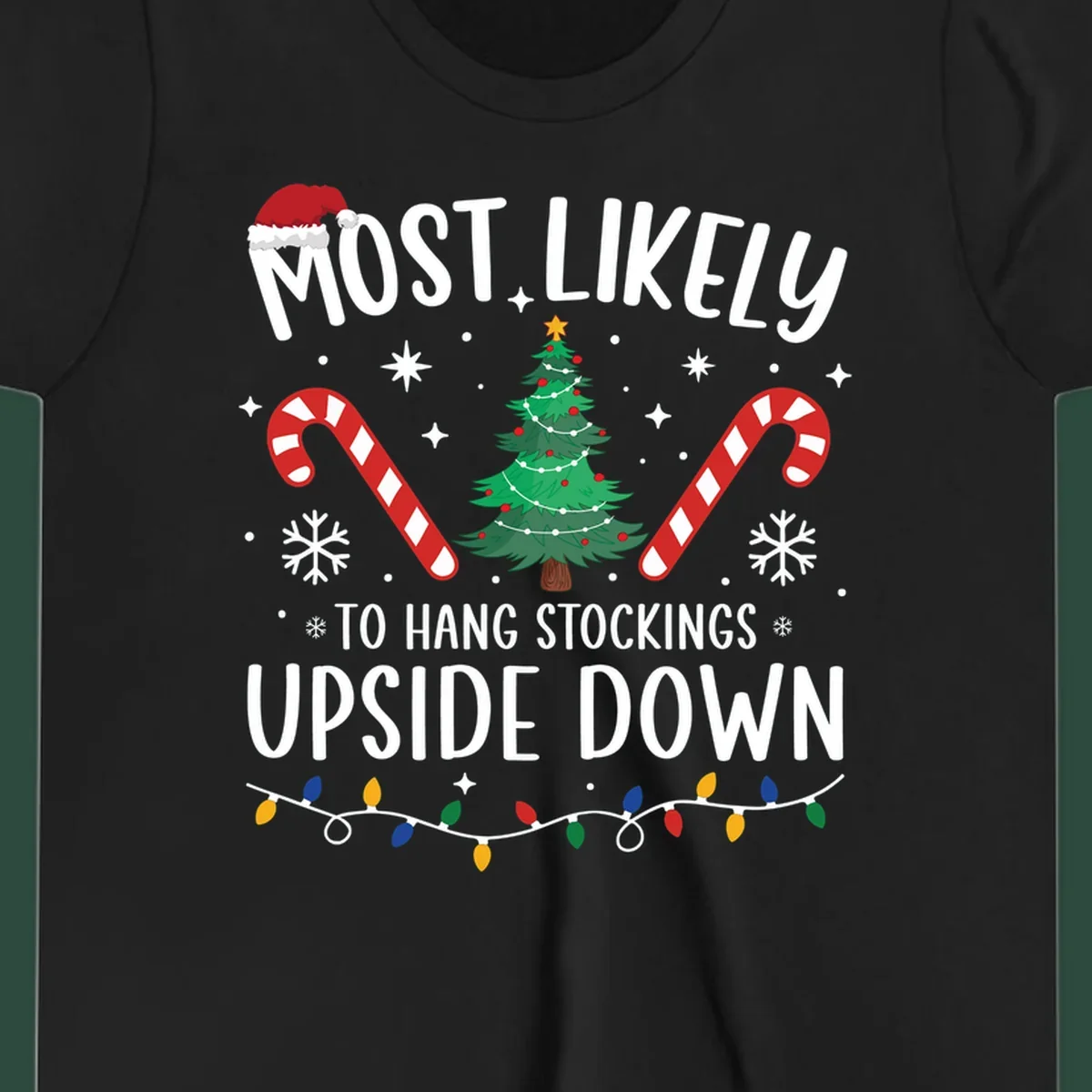 Most Likely To Hang Stockings Upside Down Christmas graphic with tree, candy canes, and Santa hat.