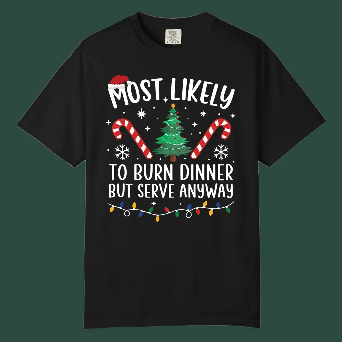 Most likely to burn dinner but serve anyway funny Christmas text with Santa hat, Christmas tree, and candy canes.