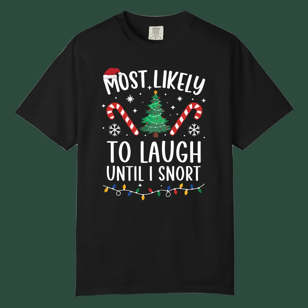Most Likely To Laugh Until I Snort Christmas design with festive graphics.