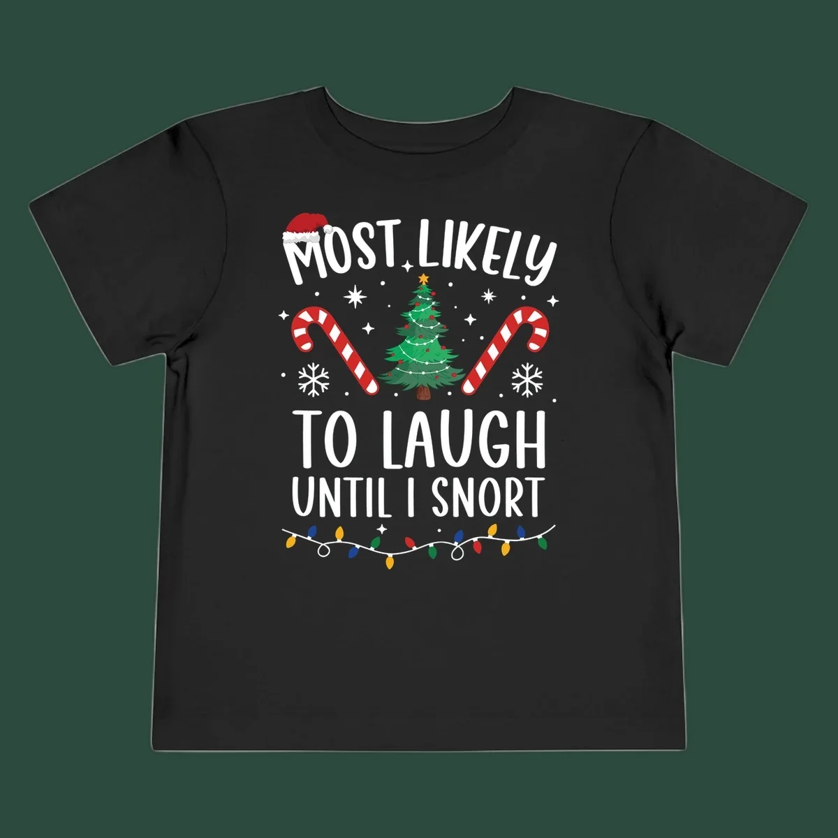 Most Likely To Laugh Until I Snort Christmas design with festive graphics.