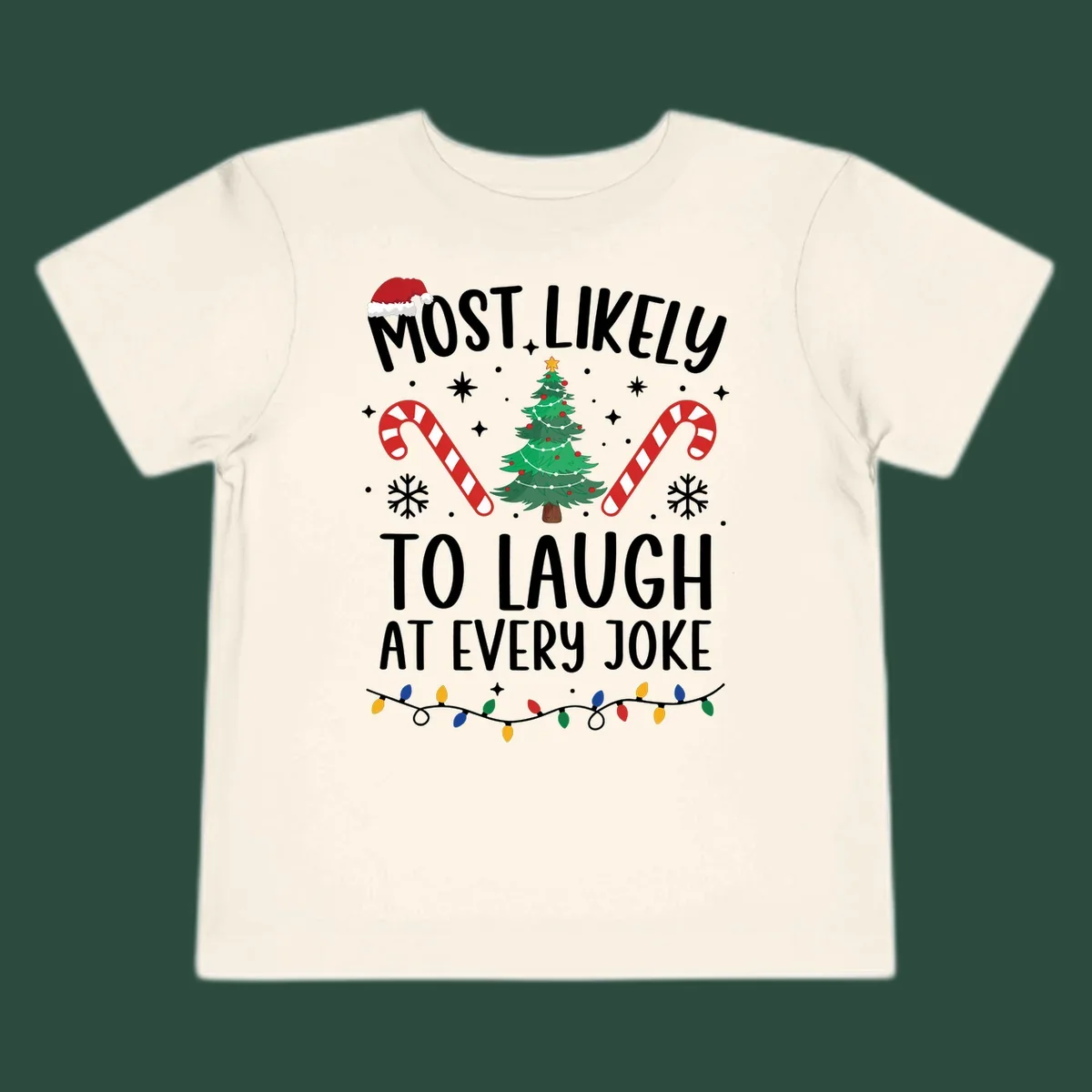Most Likely To Laugh At Every Joke Christmas text with Santa hat, tree, candy canes, and lights.