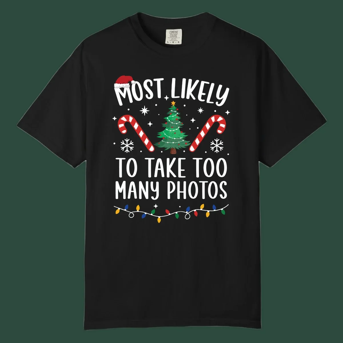 Most Likely To Take Too Many Photos Christmas design with text, candy canes, Christmas tree, and Santa hat.