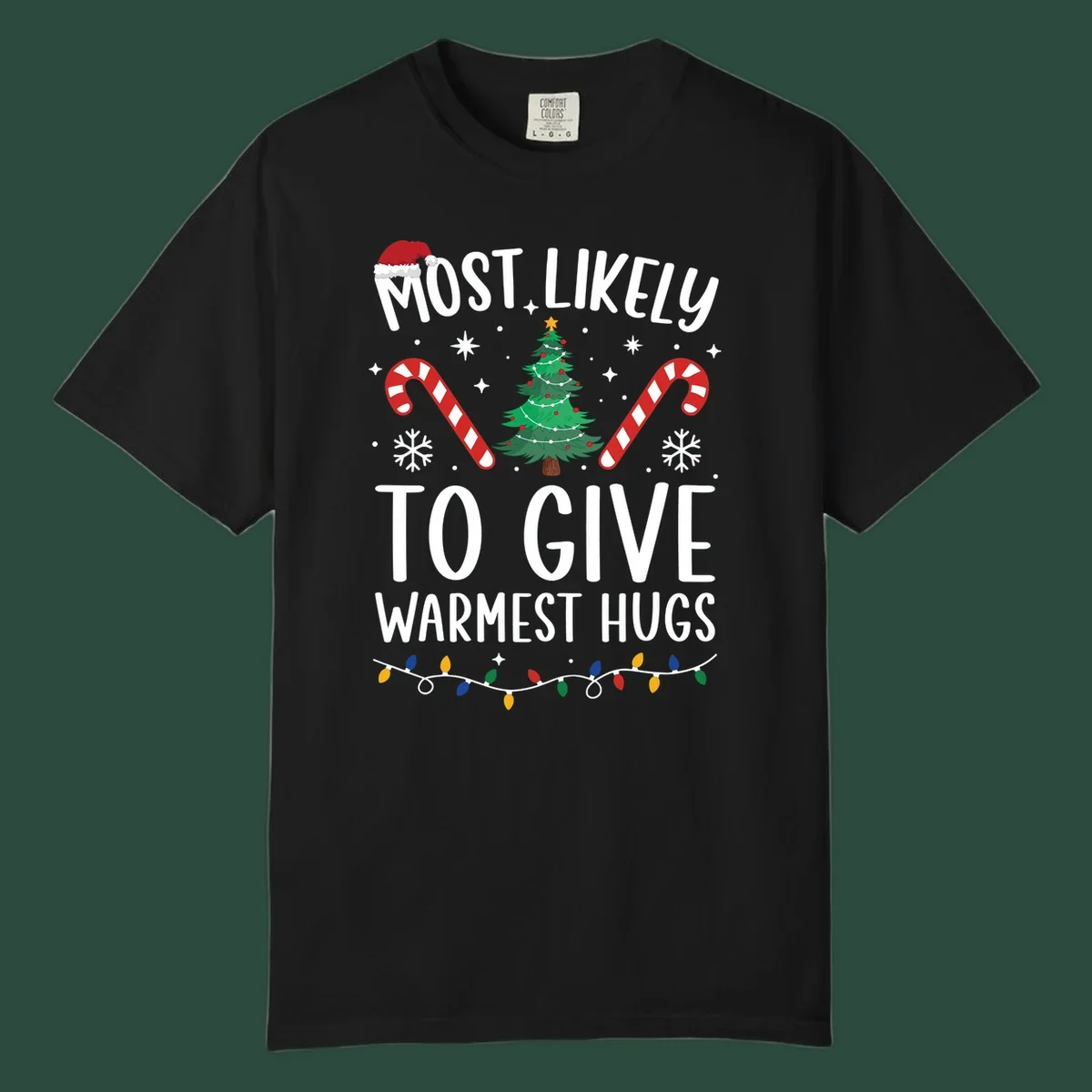 Christmas 'Most Likely To Give Warmest Hugs' design with tree, candy canes, and lights.