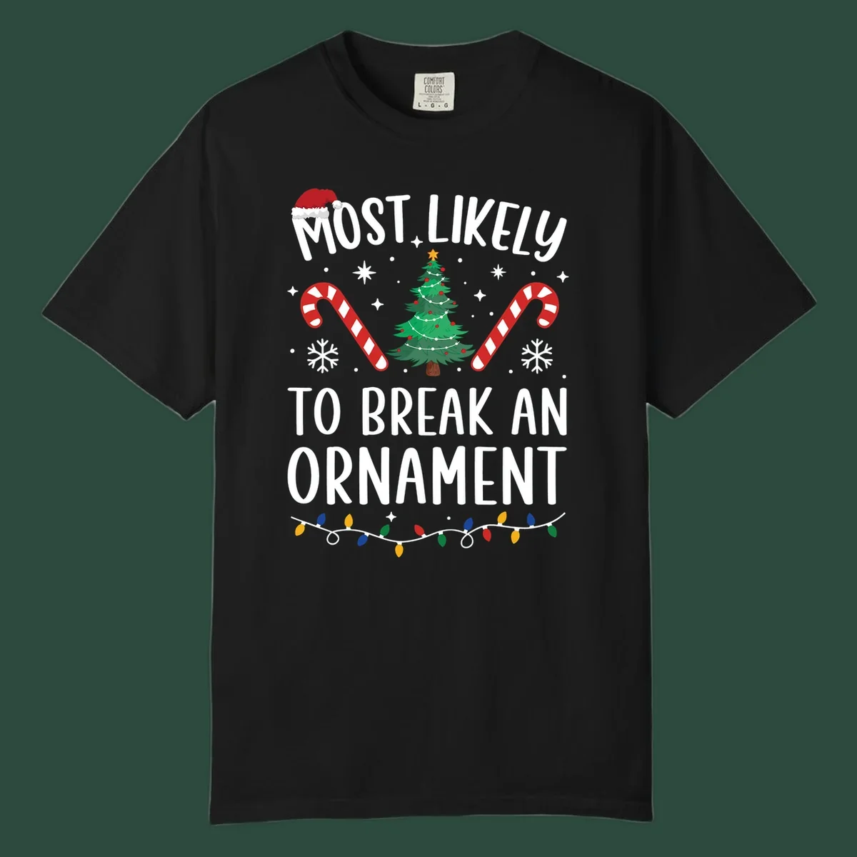 Most likely to break ornament Christmas graphic with text, tree, candy canes, and Santa hat.