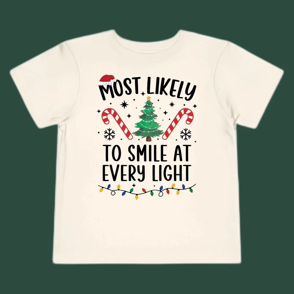 Most Likely To Smile At Every Light Christmas design with tree, candy canes, and lights.