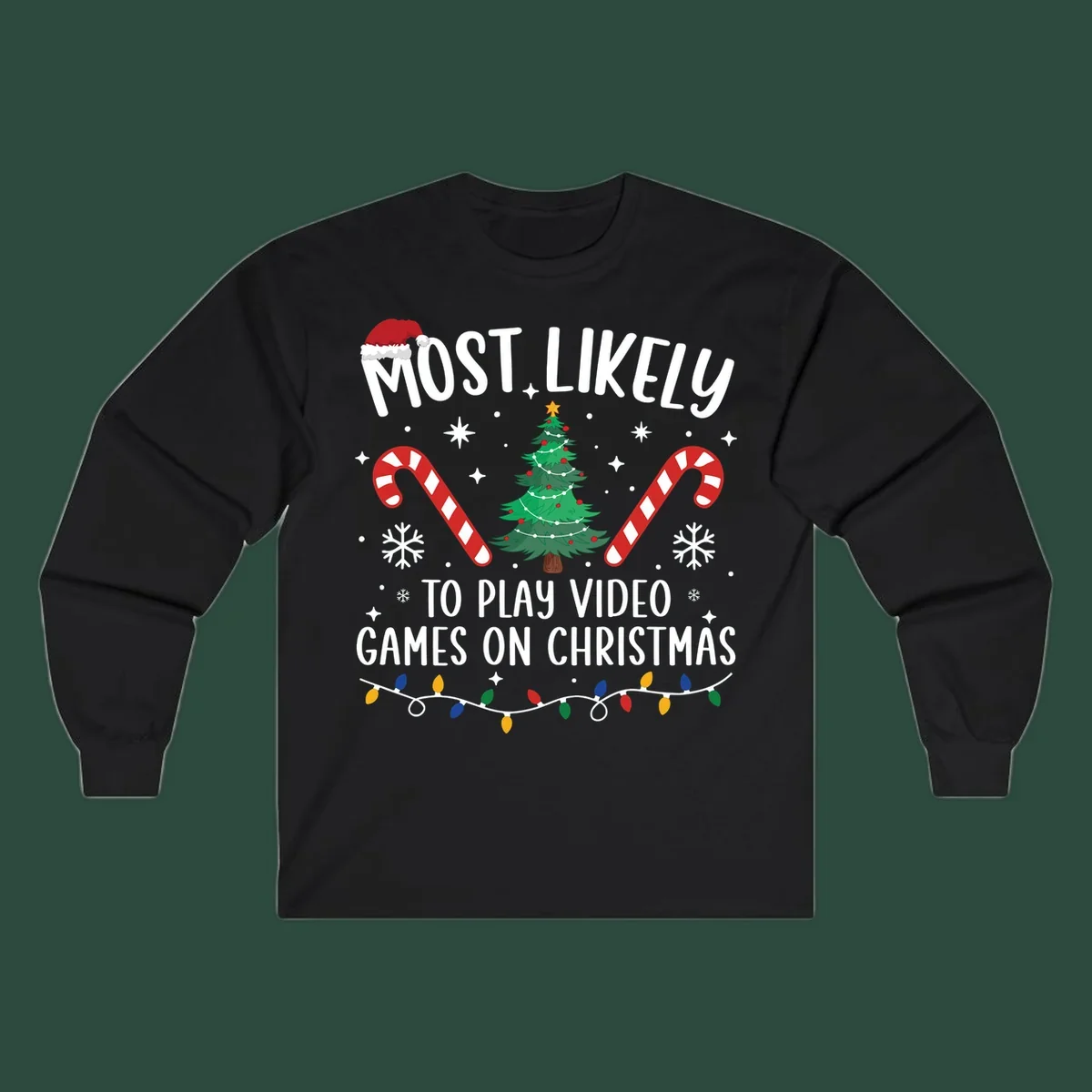 Most Likely To Play Video Games On Christmas design with text, Christmas tree, candy canes, and lights.