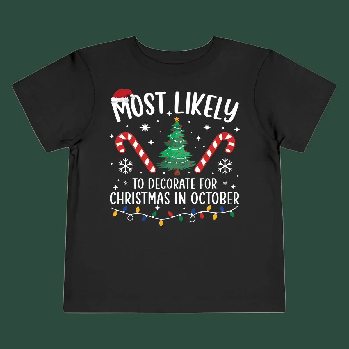Most Likely To Decorate For Christmas In October text with Christmas tree, candy canes, and Santa hat.
