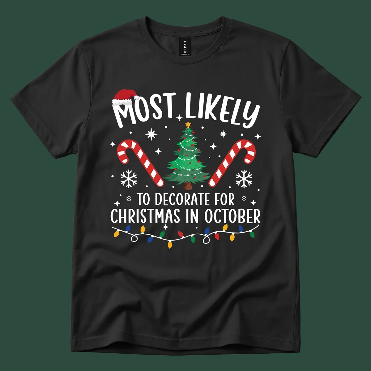 Most Likely To Decorate For Christmas In October text with Christmas tree, candy canes, and Santa hat.
