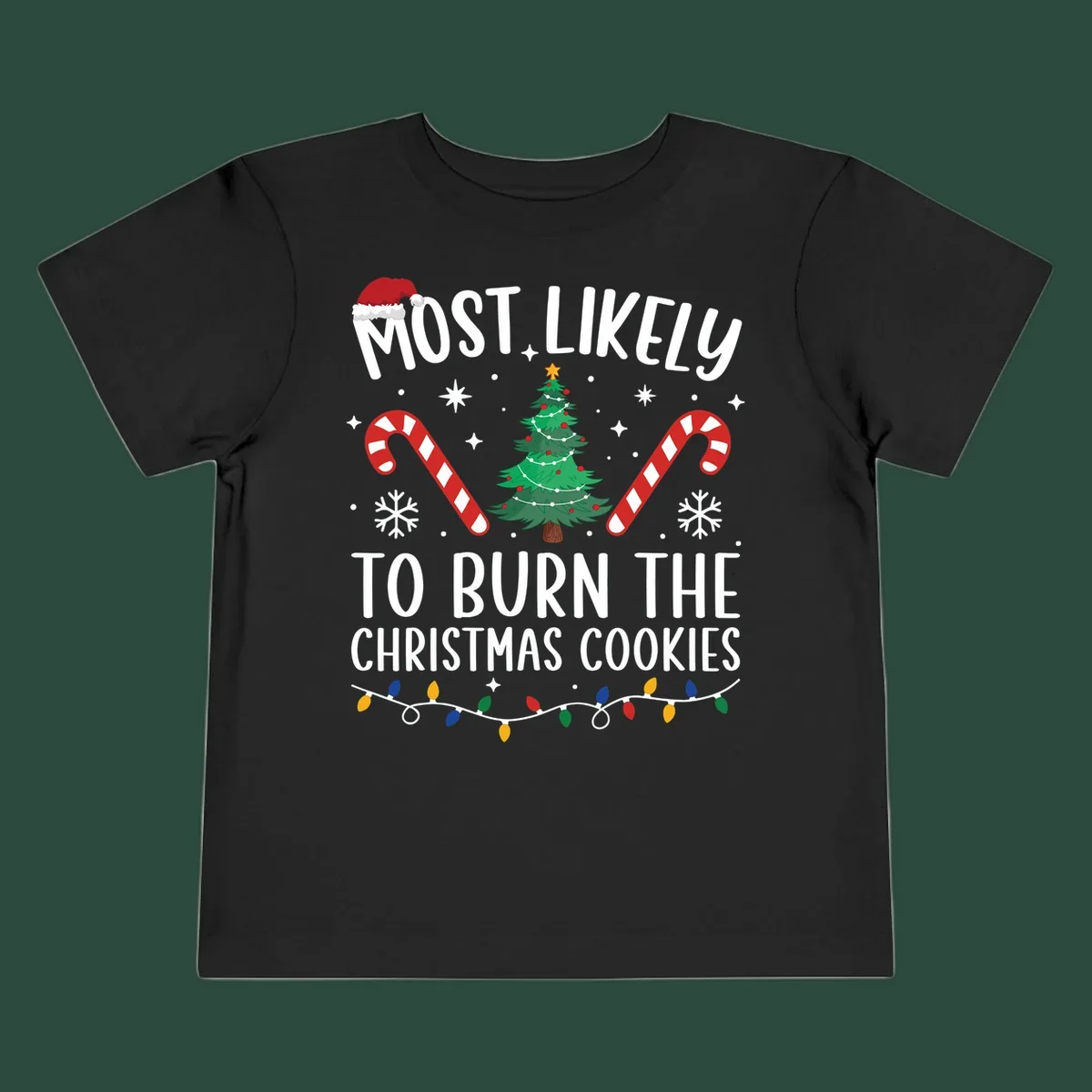 Most likely to burn Christmas Cookies text with Santa hat, Christmas tree, candy canes, snowflakes, stars, and lights. Christmas baking humor.