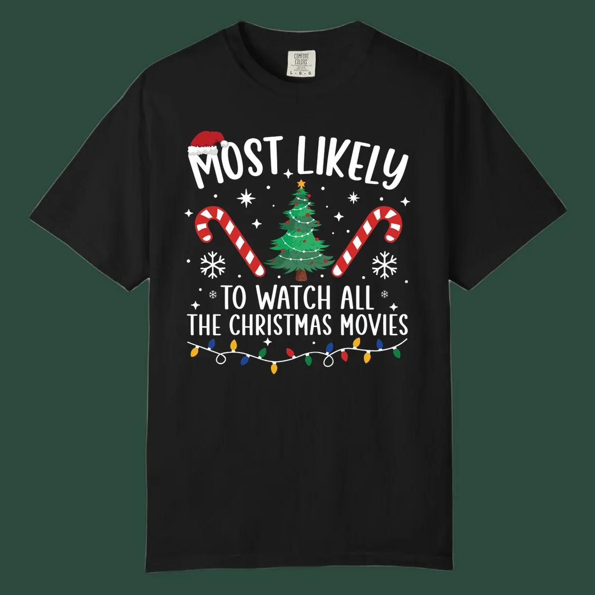 Most Likely To Watch All The Christmas Movies text with christmas tree, candy canes, and lights.