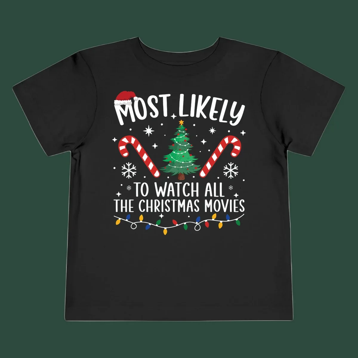 Most Likely To Watch All The Christmas Movies text with christmas tree, candy canes, and lights.