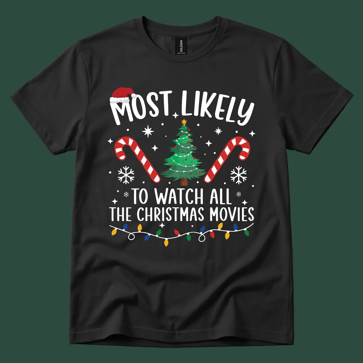 Most Likely To Watch All The Christmas Movies text with christmas tree, candy canes, and lights.
