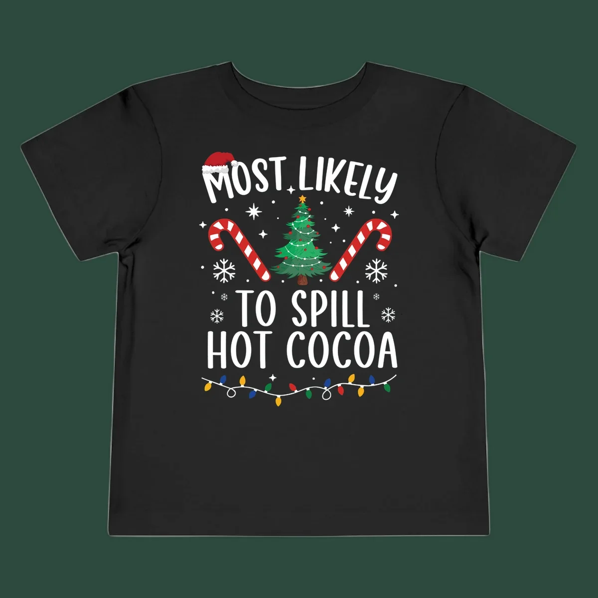 Most Likely To Spill Hot Cocoa Christmas design with text, tree, candy canes, and lights.