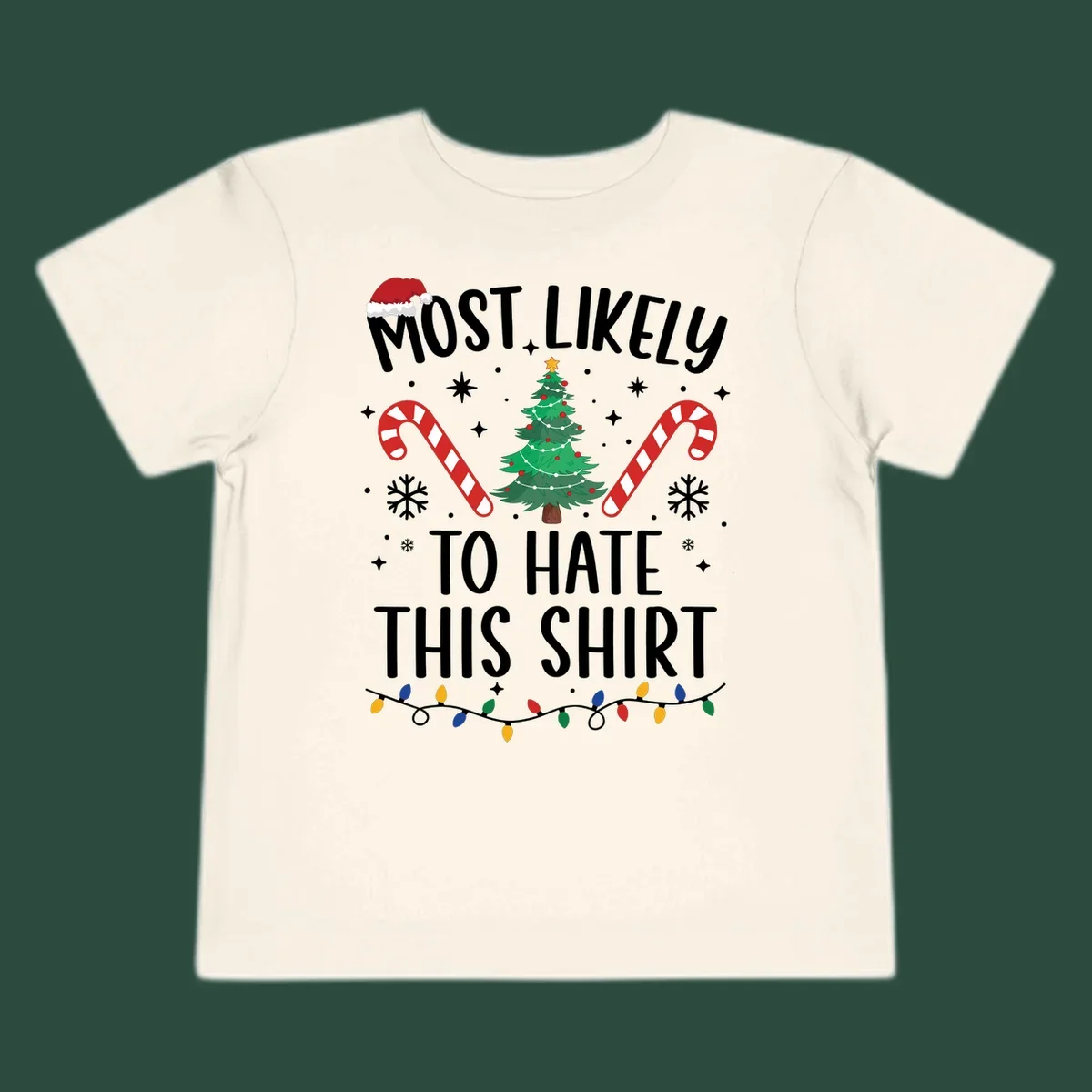 Text 'Most Likely To Hate This Shirt' with Christmas graphics like a tree, candy canes, and Santa hat.