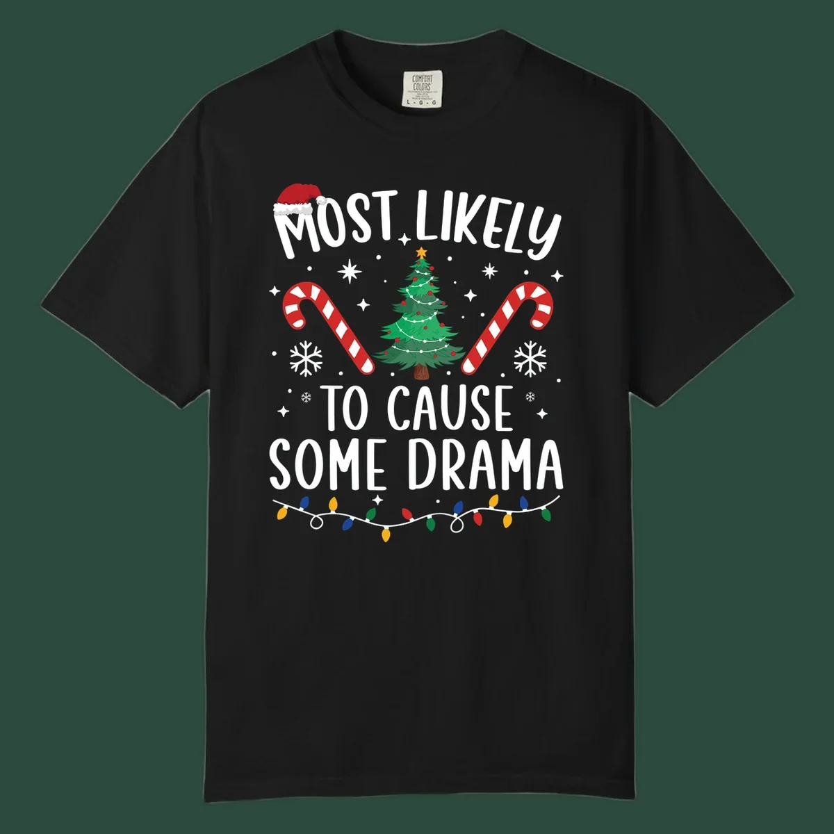 Most Likely To Cause Some Drama Christmas text with tree and decorations. Christmas crew shirt.