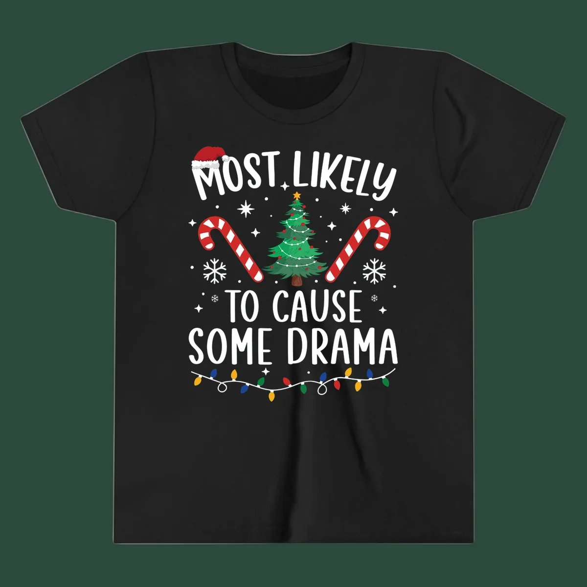 Most Likely To Cause Some Drama Christmas text with tree and decorations. Christmas crew shirt.