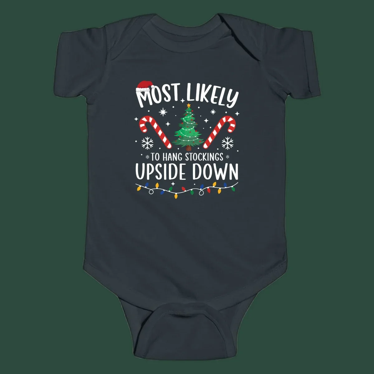 Most Likely To Hang Stockings Upside Down Christmas graphic with tree, candy canes, and Santa hat.