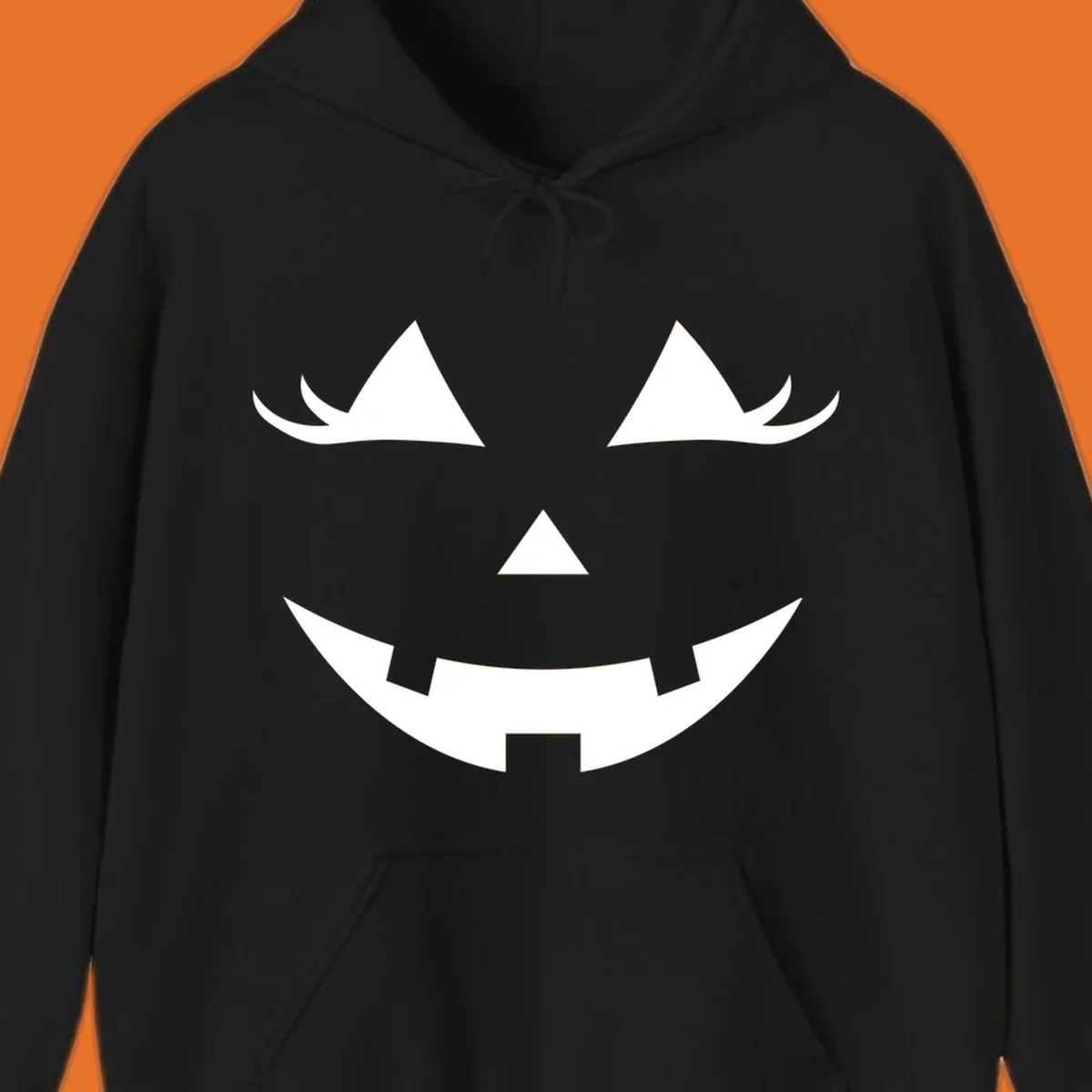 Spooky grinning jack-o-lantern face with triangle eyes and jagged smile, graphic for halloween.