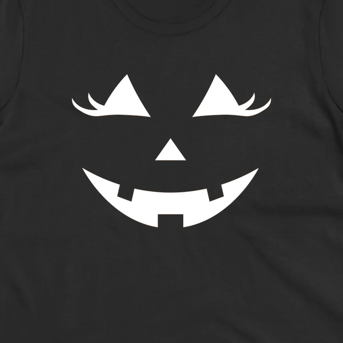 Spooky grinning jack-o-lantern face with triangle eyes and jagged smile, graphic for halloween.