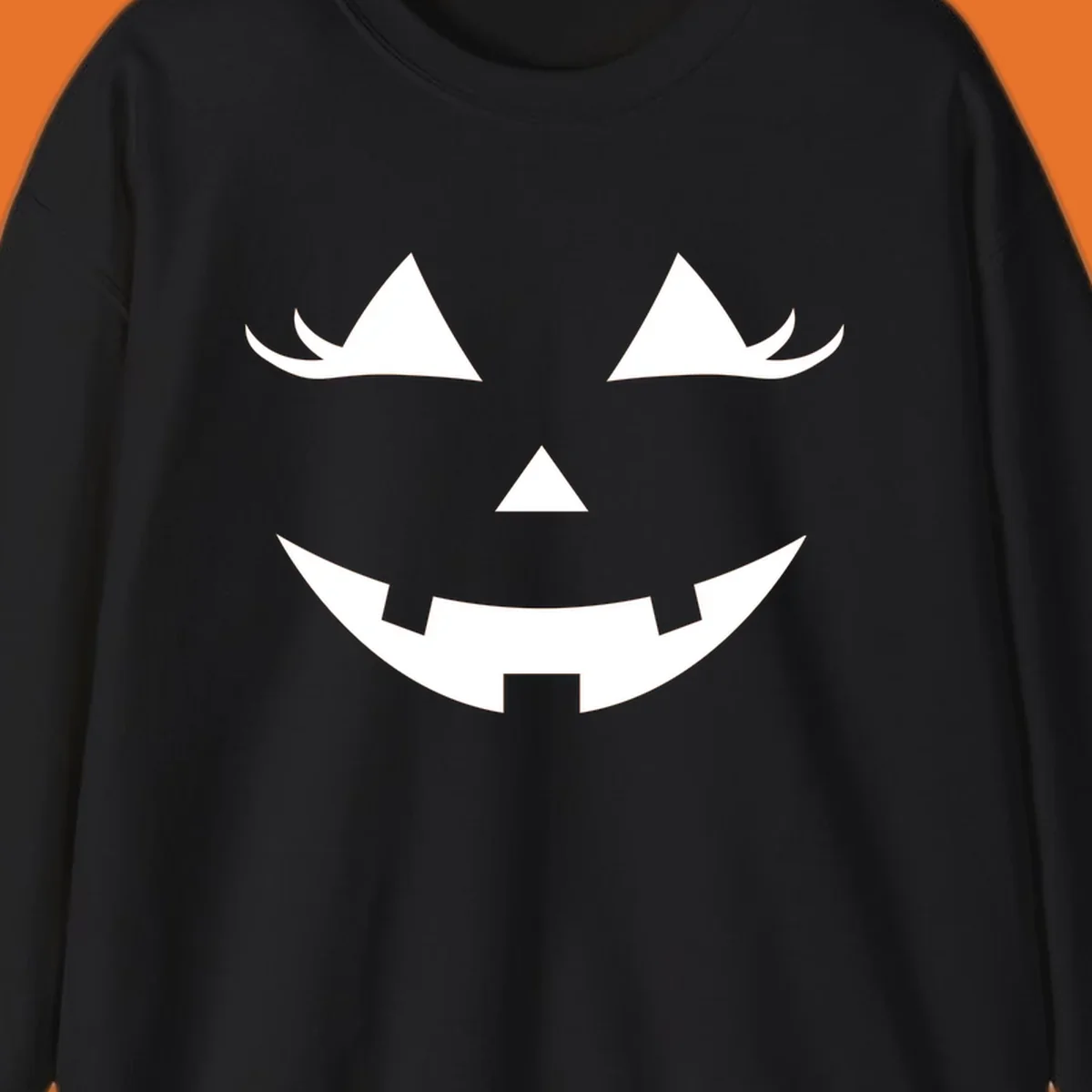 Spooky grinning jack-o-lantern face with triangle eyes and jagged smile, graphic for halloween.