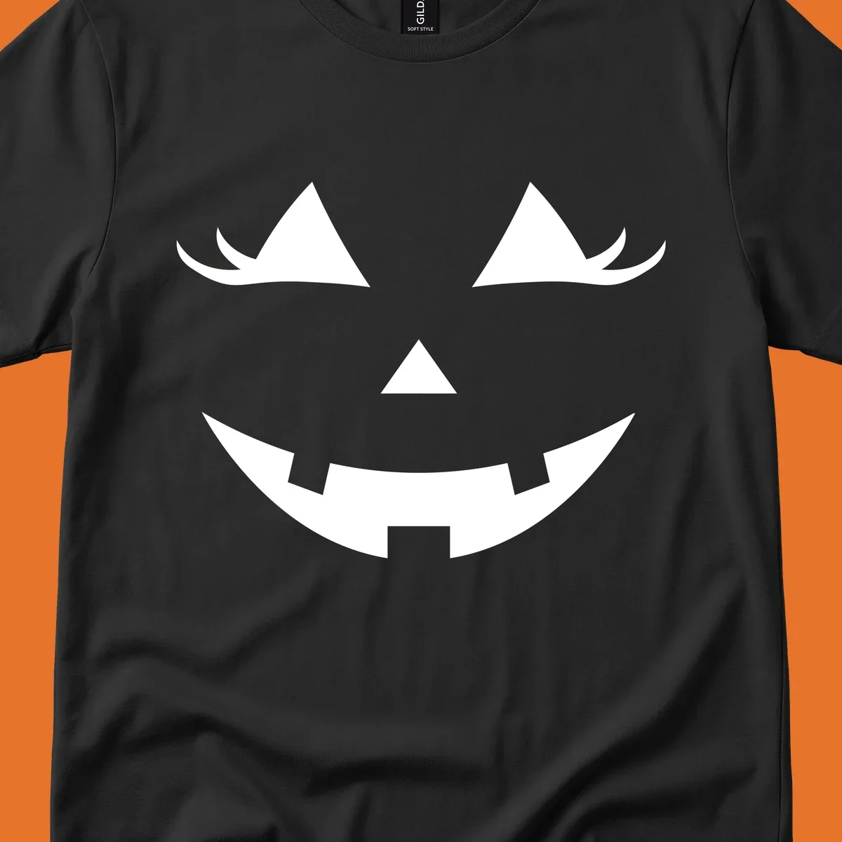 Spooky grinning jack-o-lantern face with triangle eyes and jagged smile, graphic for halloween.