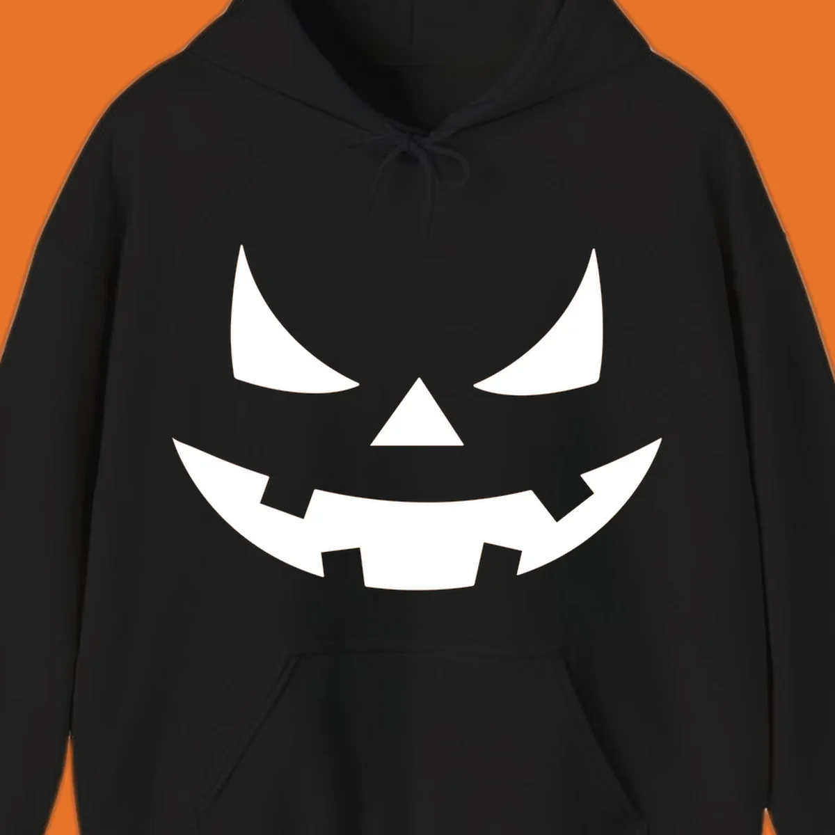 Spooky jack-o-lantern face illustration with angled eyes and jagged smile, for Halloween.