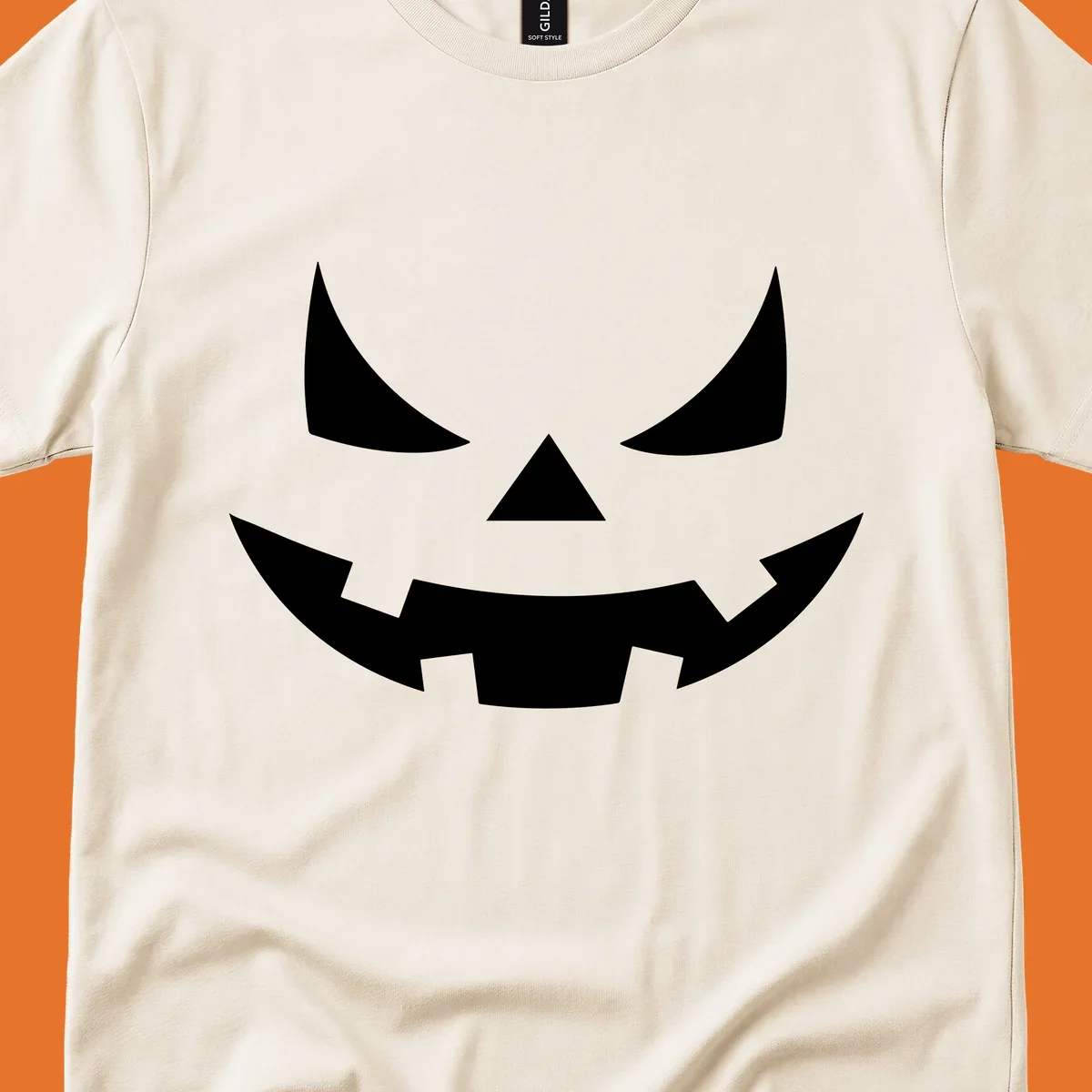 Spooky jack-o-lantern face illustration with angled eyes and jagged smile, for Halloween.
