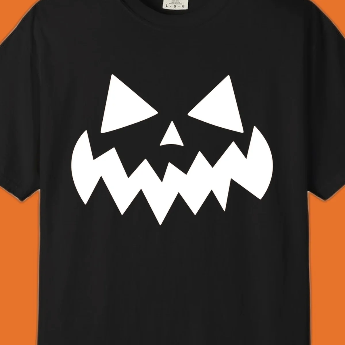 Spooky jack-o-lantern face with triangular eyes and a jagged mouth graphic.