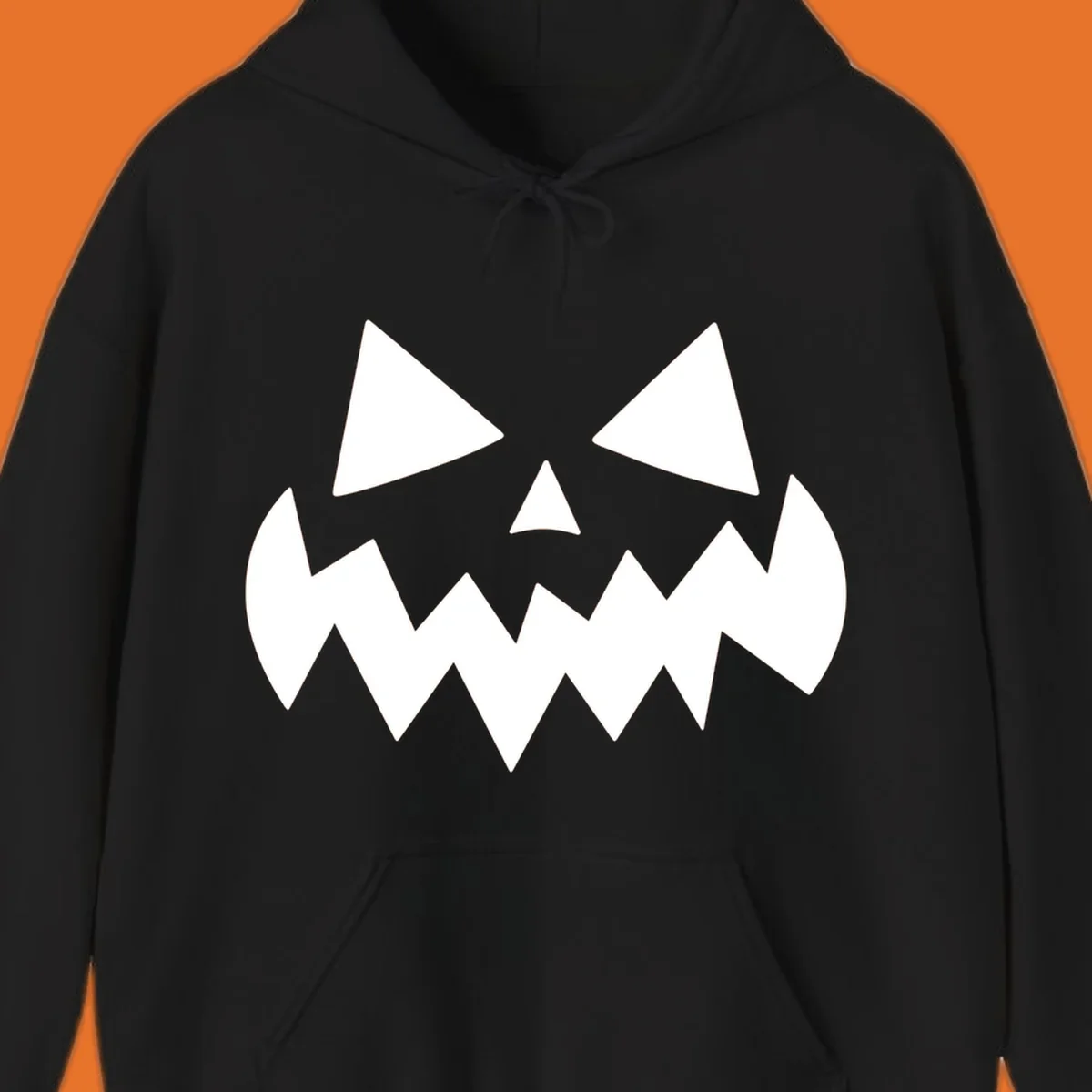 Spooky jack-o-lantern face with triangular eyes and a jagged mouth graphic.