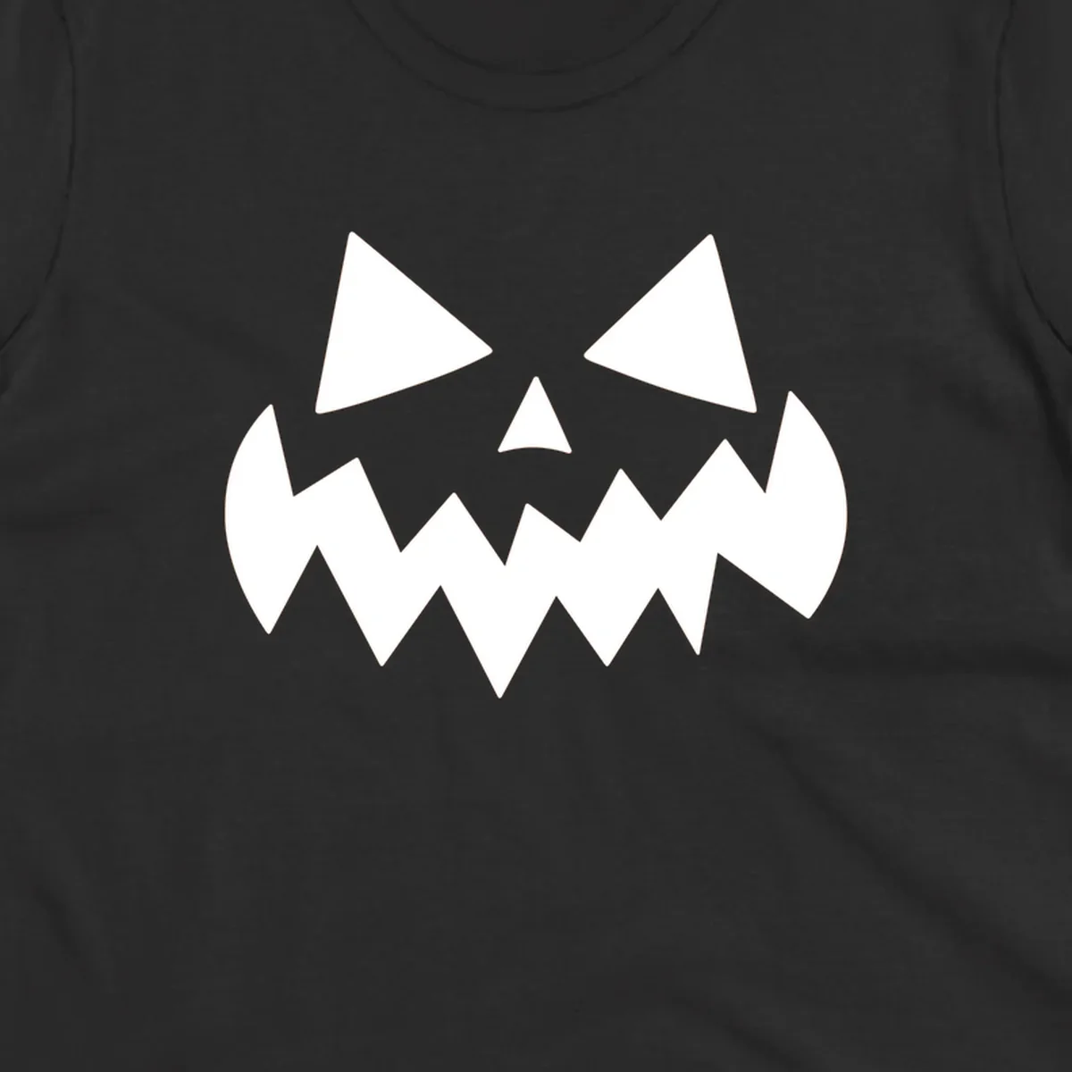 Spooky jack-o-lantern face with triangular eyes and a jagged mouth graphic.