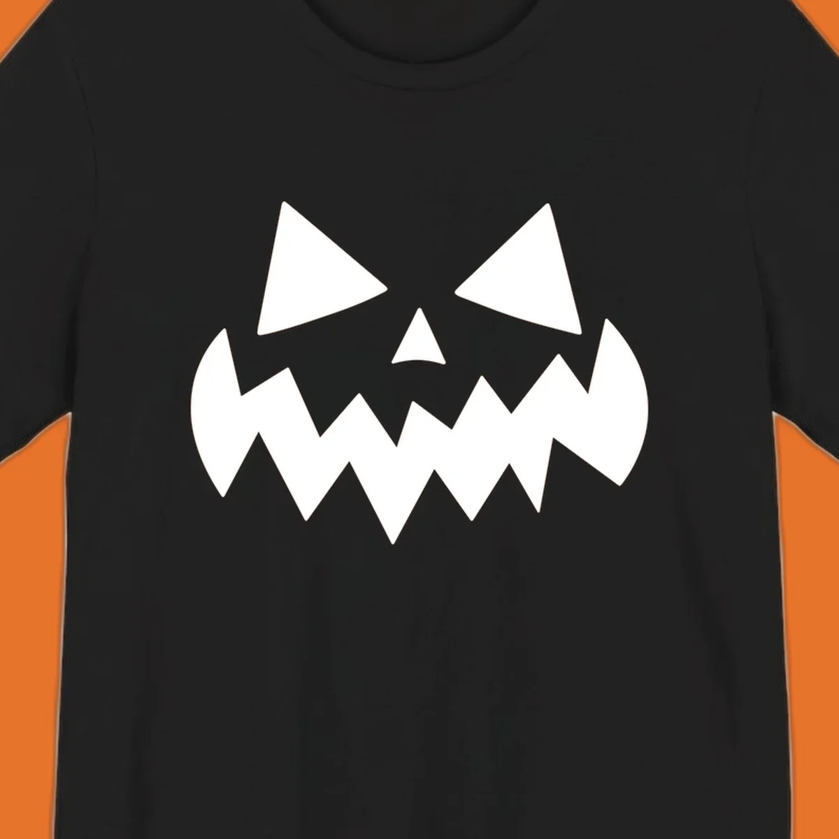 Spooky jack-o-lantern face with triangular eyes and a jagged mouth graphic.