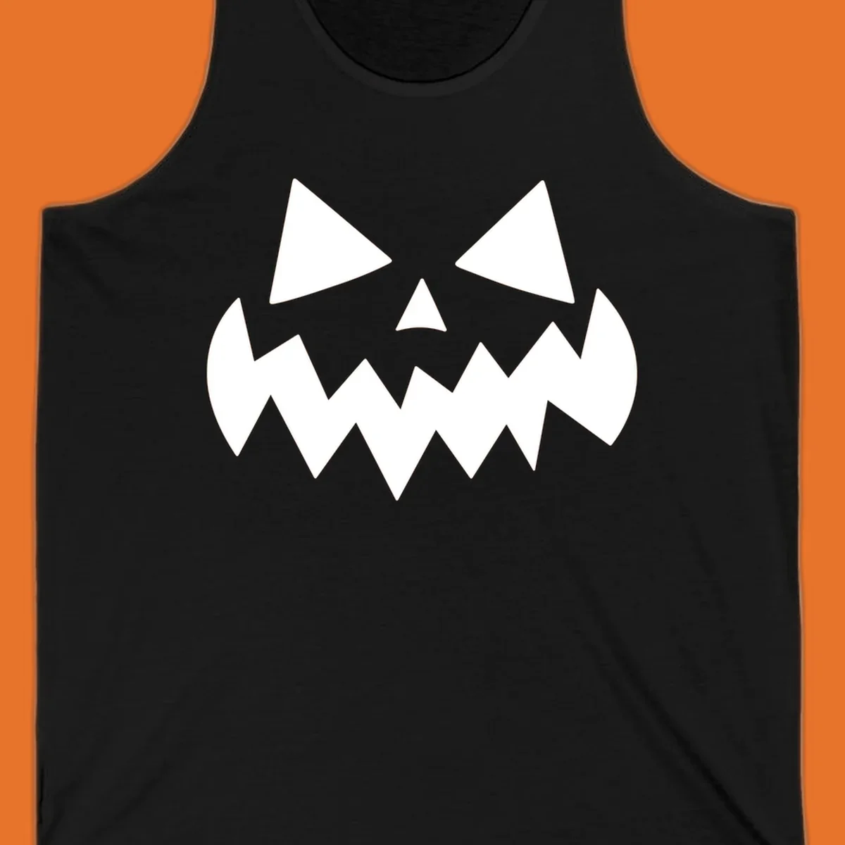 Spooky jack-o-lantern face with triangular eyes and a jagged mouth graphic.