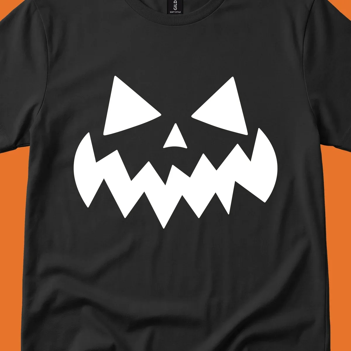 Spooky jack-o-lantern face with triangular eyes and a jagged mouth graphic.