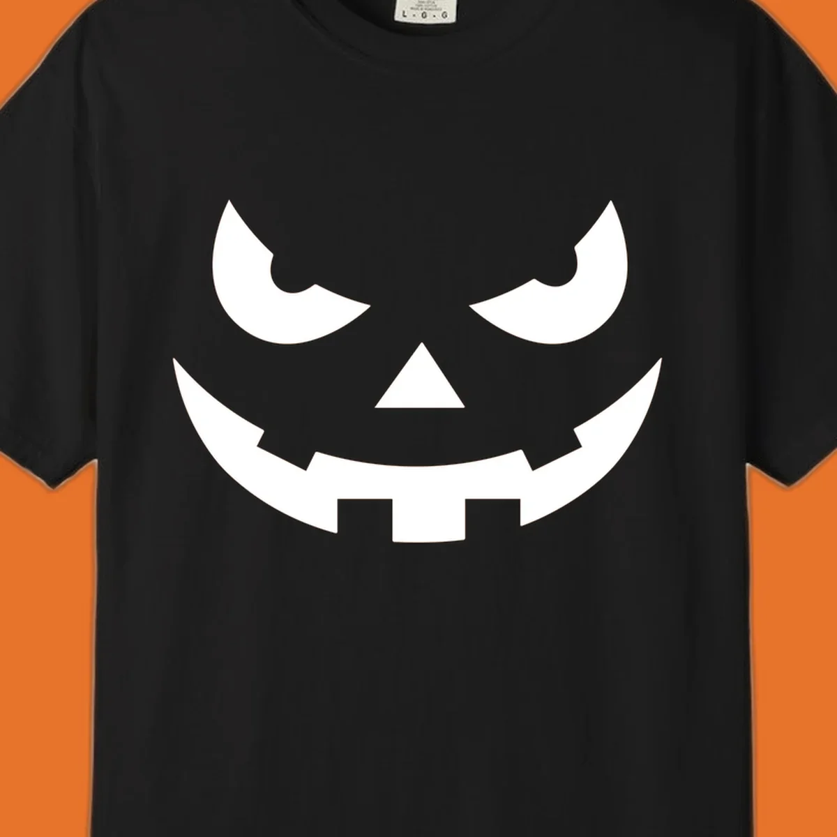 Spooky pumpkin face graphic with sharp eyes and a jagged grin.