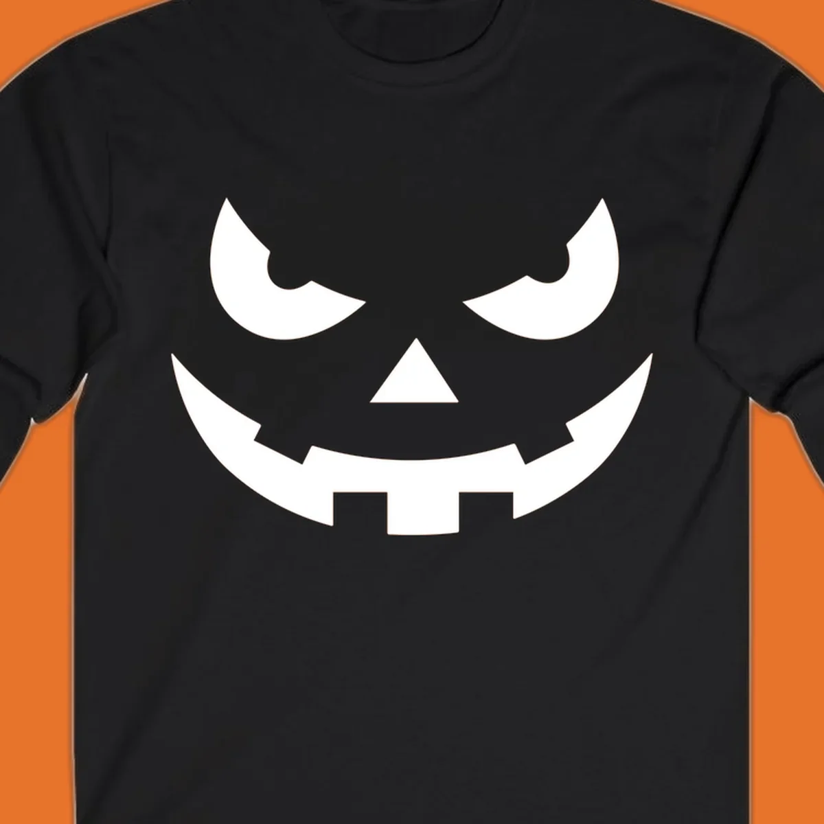 Spooky pumpkin face graphic with sharp eyes and a jagged grin.