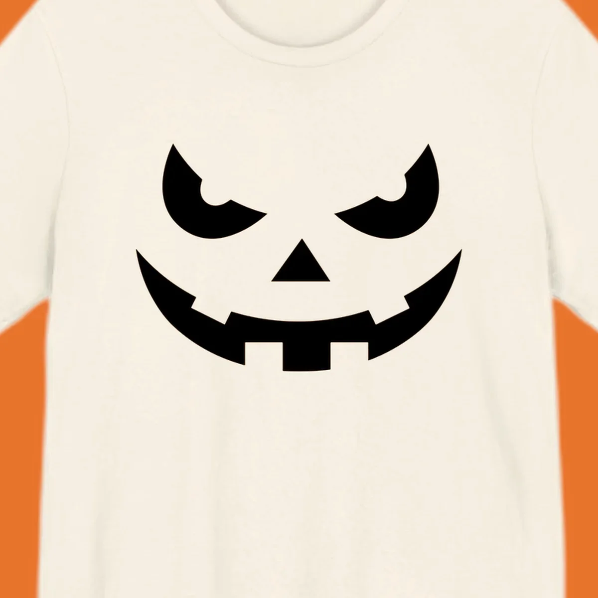 Spooky pumpkin face graphic with sharp eyes and a jagged grin.
