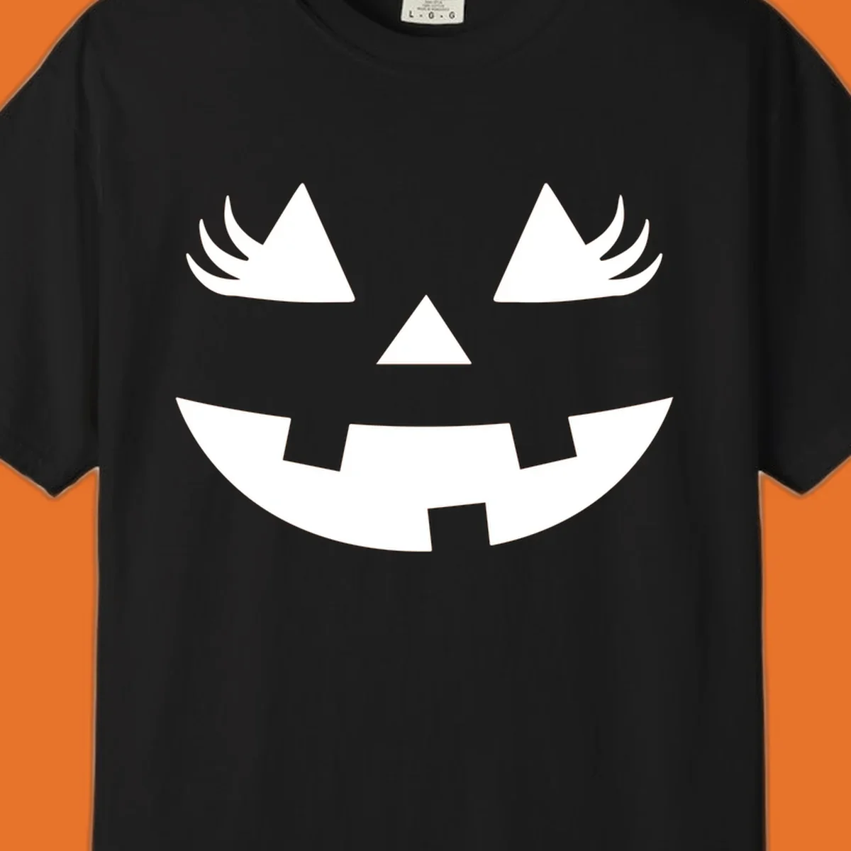 Jack o' lantern face with triangle eyes, nose, and jagged smile, featuring eyelashes.