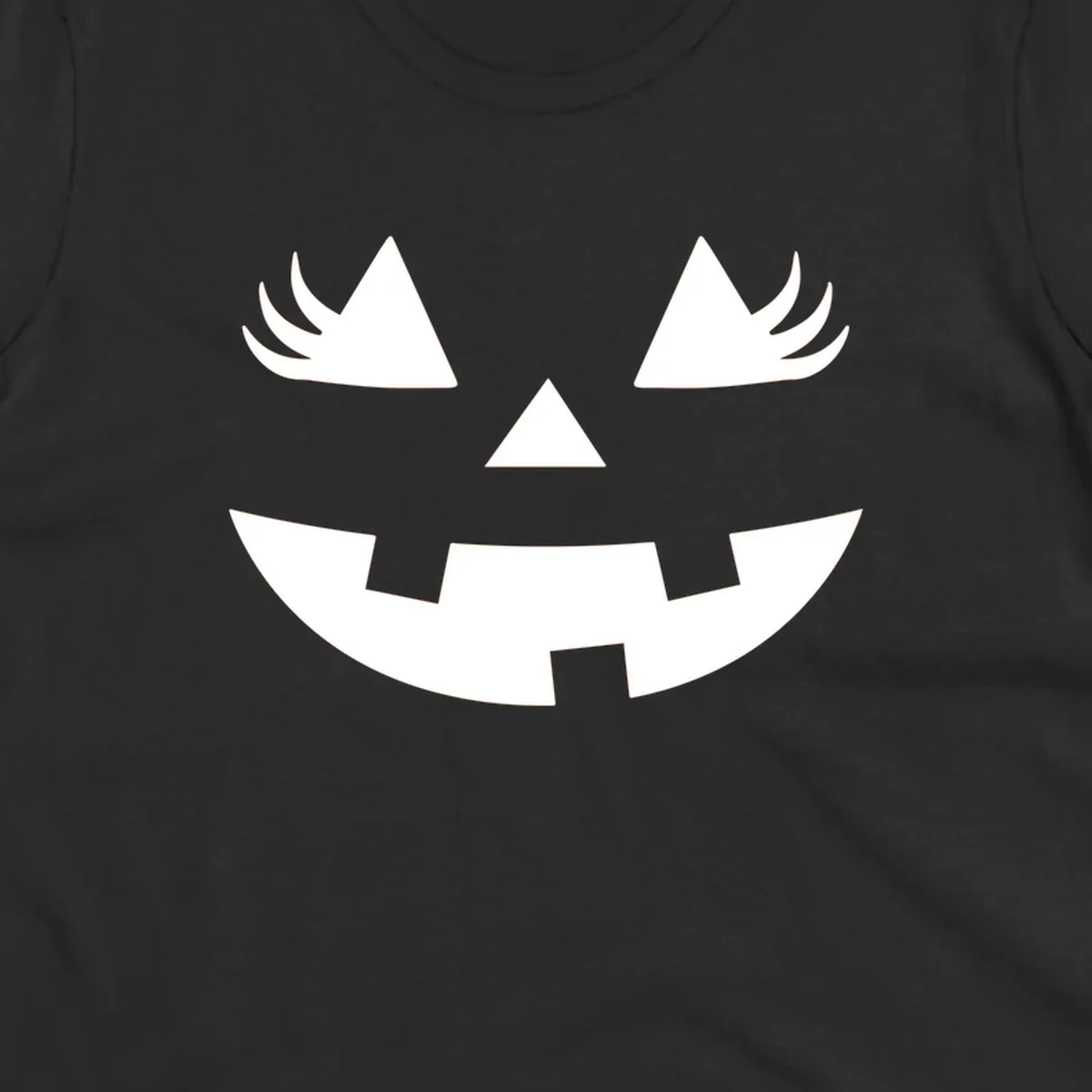 Jack o' lantern face with triangle eyes, nose, and jagged smile, featuring eyelashes.