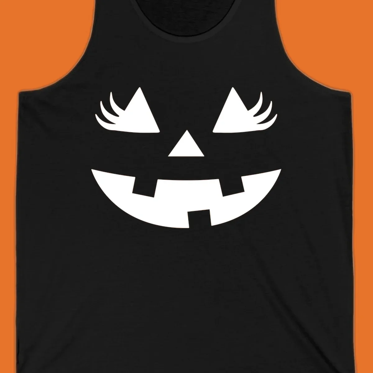 Jack o' lantern face with triangle eyes, nose, and jagged smile, featuring eyelashes.