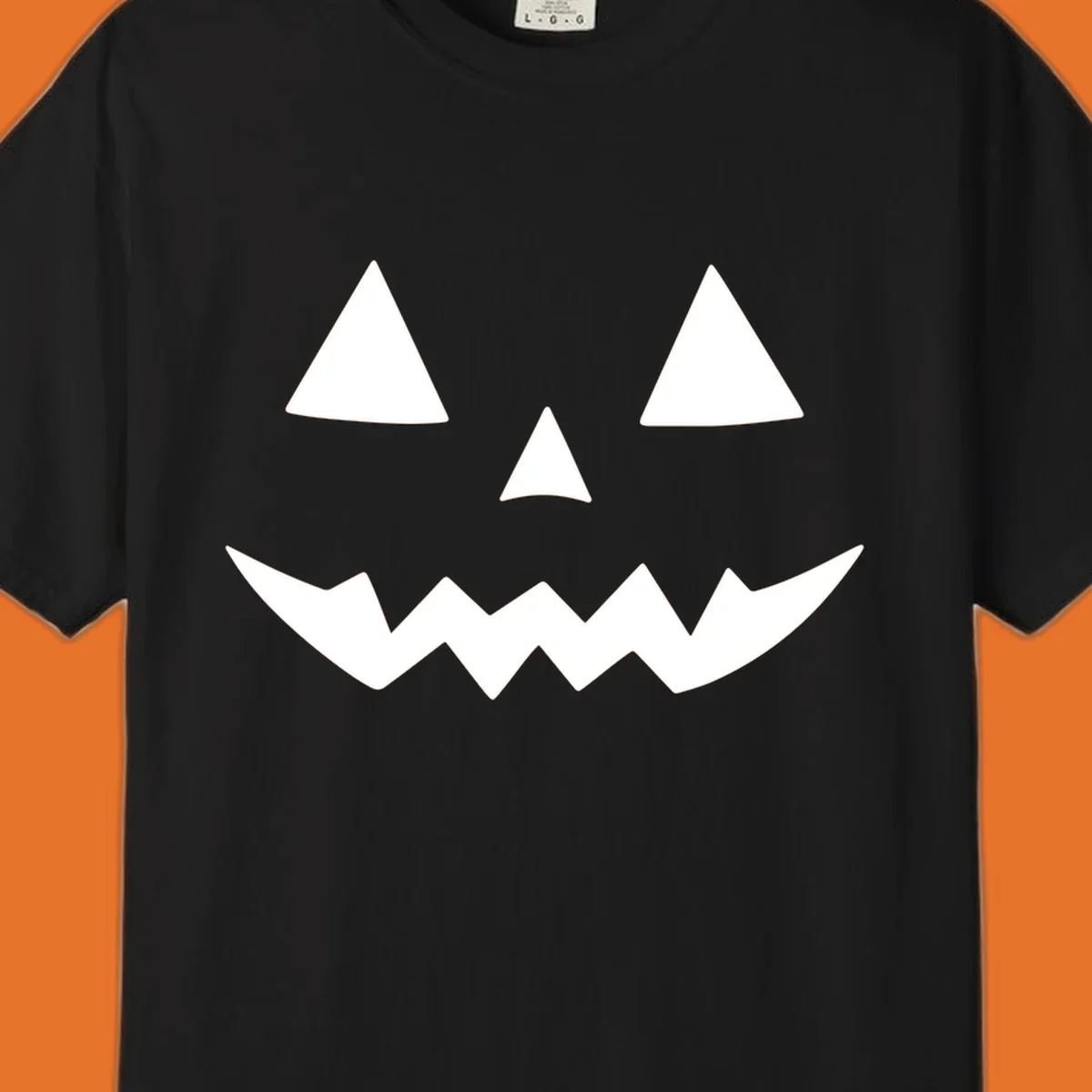 Classic jack-o-lantern face with triangle eyes and jagged mouth graphic.