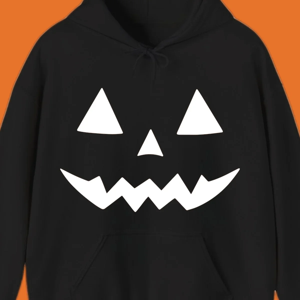 Classic jack-o-lantern face with triangle eyes and jagged mouth graphic.